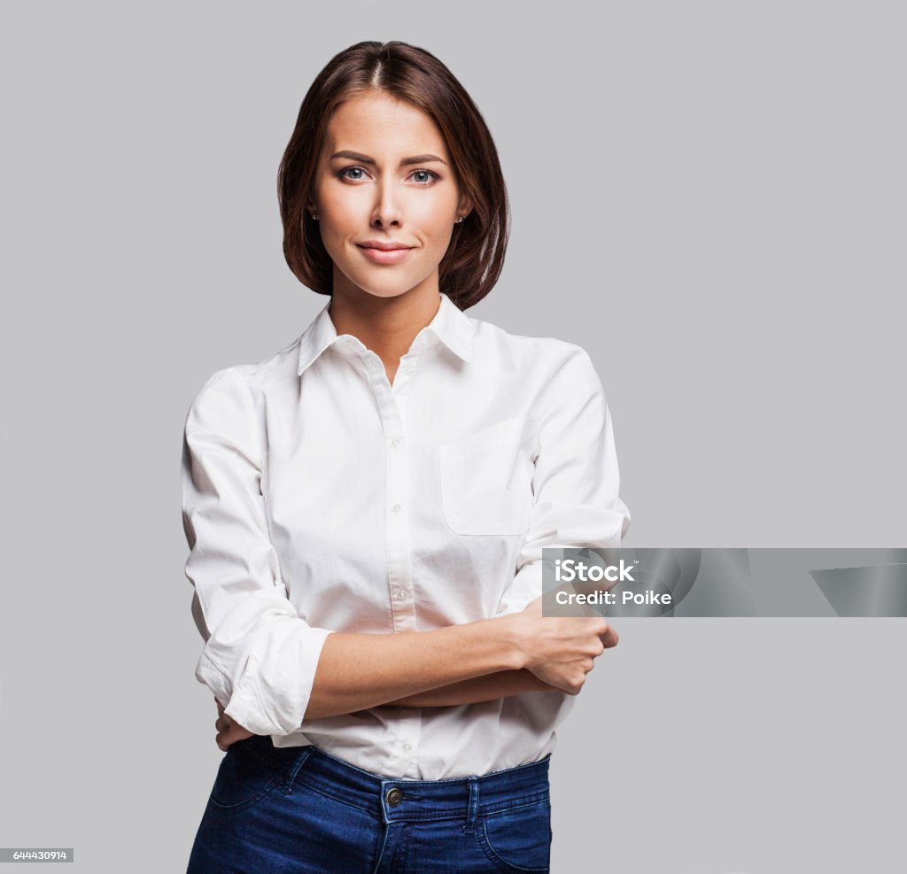 Businesswoman studio portrait Beautiful successful girl portrait. Studio shot. Isolated on gray background Women Stock Photo