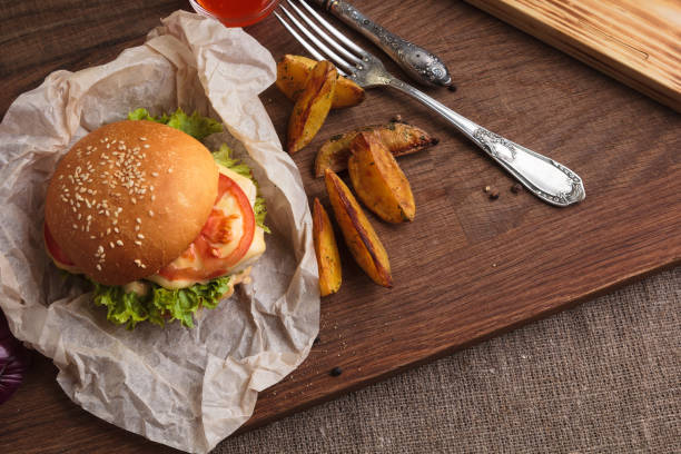 istock Classic burger with chicken and potato wedges 644444746