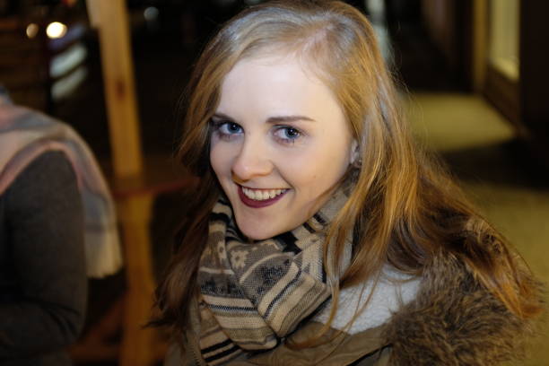 Young woman in warm clothing smiling