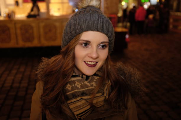 istock Young woman in warm clothing smiling 644452122