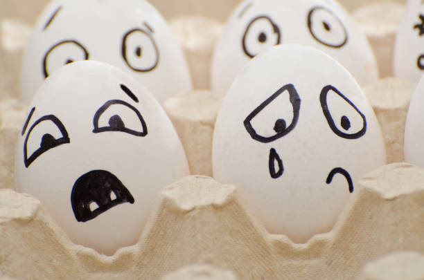 istock Eggs with the drawn emotions, frightened and crying face 644462392