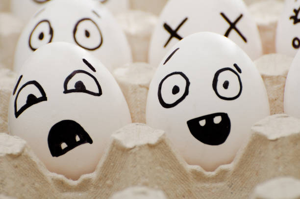 istock Two eggs with painted emotions: fear and surprise. Close-up 644463152