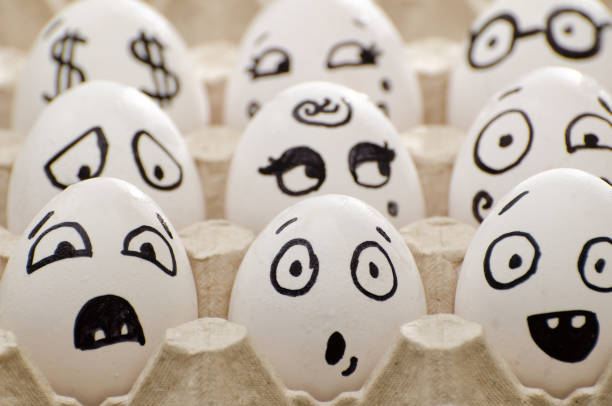 istock Eggs with painted emotions in the tray, close-up 644464114