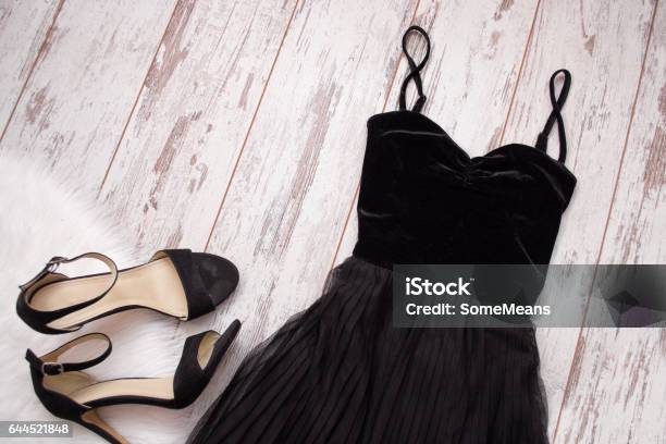 Black Evening Dress And Shoes On A Wooden Background Fashion Concept Top View Space For Text Stock Photo - Download Image Now