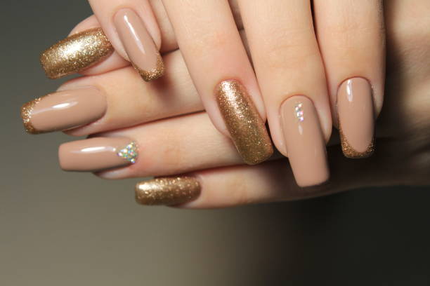 istock French manicure with gold sequins 644539222