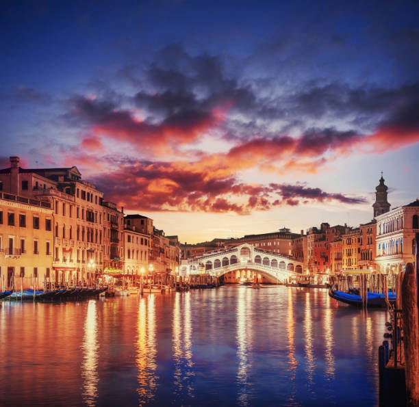 City landscape. Rialto Bridge in Venice at sunset. Italy. Many tourists visiting the beauty of the city throughout the year. Europe
