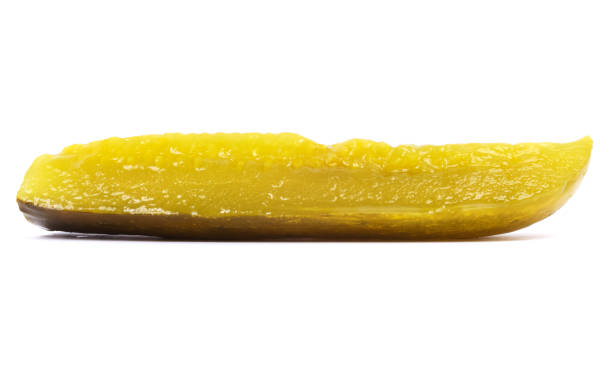 Isolated Pickle Sliced pickle on a white background. dill pickle stock pictures, royalty-free photos & images