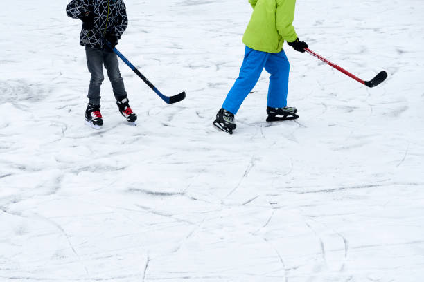 istock Children playing ice hockey 644568436