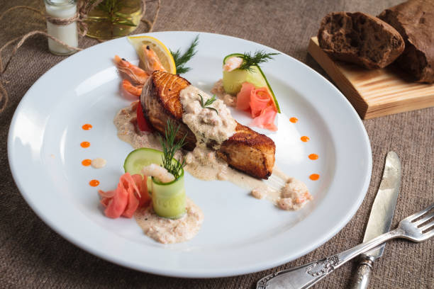 istock Grilled salmon with shrimp and cream sauce 644569414