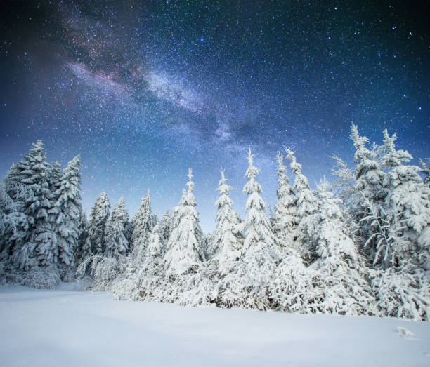 istock fantastic winter meteor shower and the snow-capped mountains. Ca 644576972