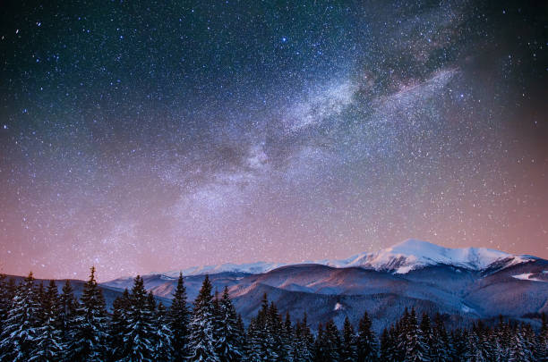 istock fantastic winter meteor shower and the snow-capped mountains. Ca 644577080