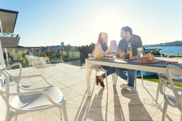 istock Couple eating breakfast outdoors. 644605898