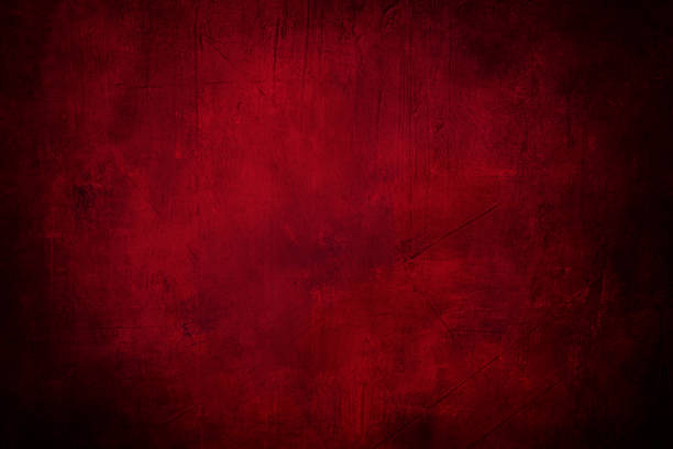 istock red grunge background or texture with dark vignette borders and spotlight 644606460
