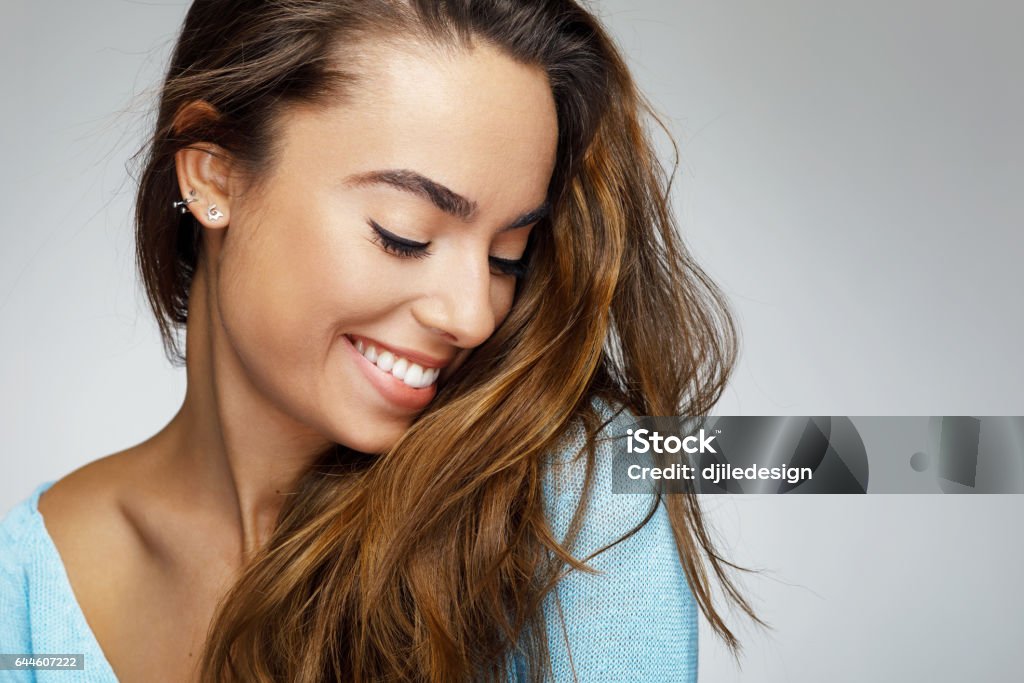 Portrait of a young woman with a beautiful smile Smiling Stock Photo