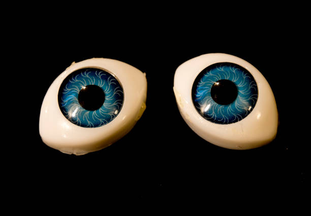 istock Detached Dolly Eyes With Blue Iris on Black Background 644615700
