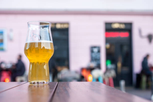 glass of beer on table edge