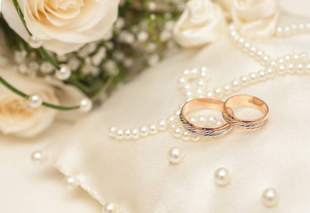 istock Wedding rings on satin pillow 644665646