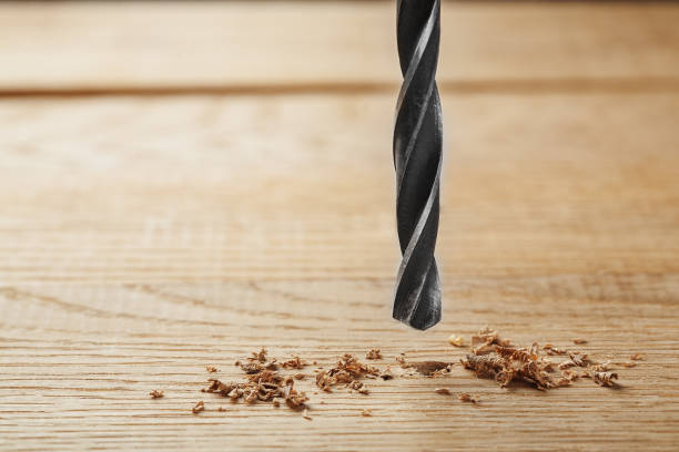 istock metal drill bit make holes in wooden oaks plank 644666514