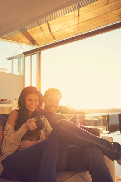 istock Couple on the sofa at sunrise. 644673424