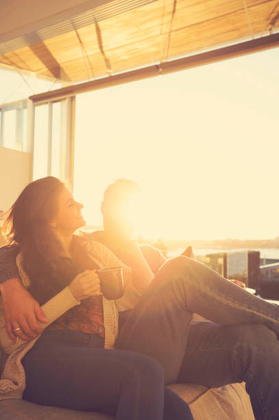 istock Couple on the sofa at sunrise. 644673428