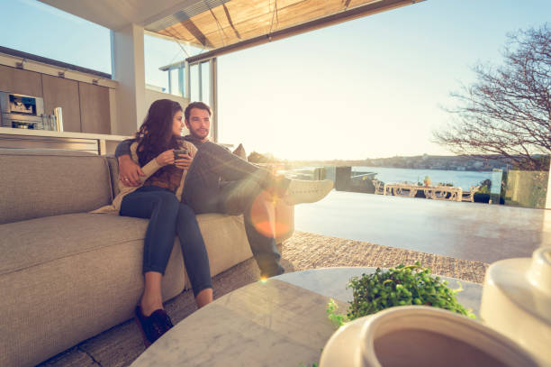 istock Couple on the sofa at sunrise. 644673430