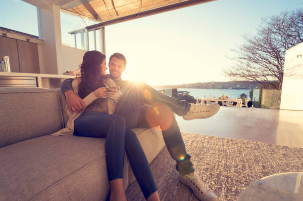 istock Couple on the sofa at sunrise. 644673440