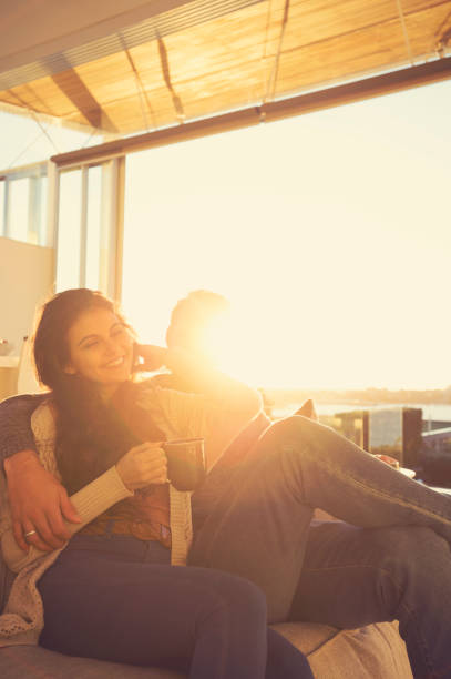 istock Couple on the sofa at sunrise. 644673444