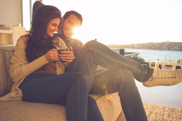 istock Couple on the sofa at sunrise. 644673450