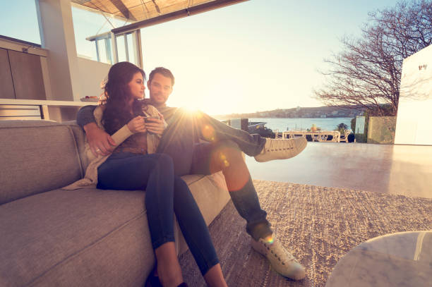 istock Couple on the sofa at sunrise. 644673452