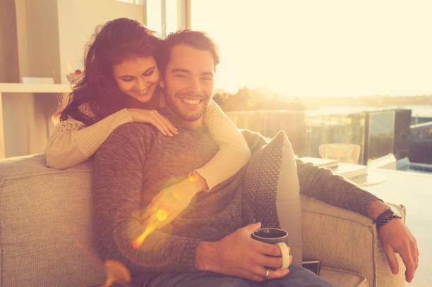 Couple on the sofa in the morning.