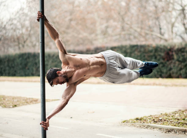 istock Man doing a flag figure part of his calisthenics routine 644688124