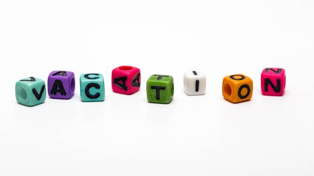 istock vacation - word made from multicolored child toy cubes with letters 644688896