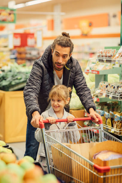 istock Father And His Daughter In A Supermarket 644702456