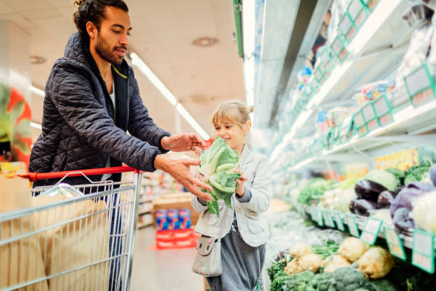 istock Father And His Daughter In A Supermarket 644703470
