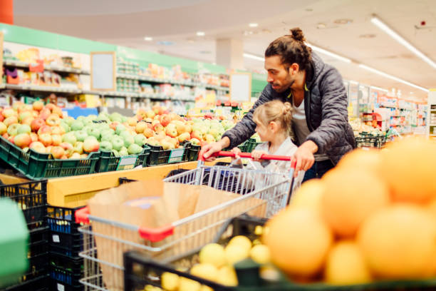 istock Father And His Daughter In A Supermarket 644704464