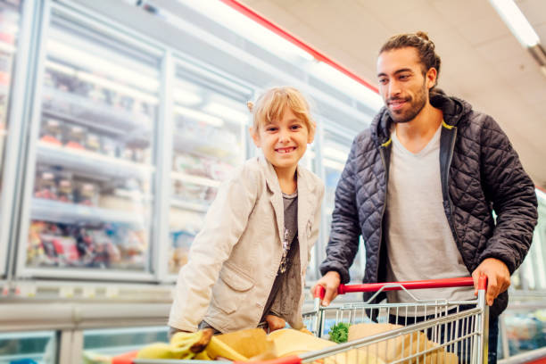 istock Father And His Daughter In A Supermarket 644705668