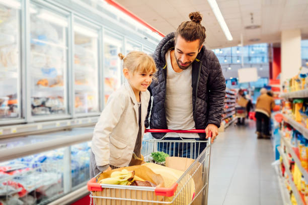 istock Father And His Daughter In A Supermarket 644705742