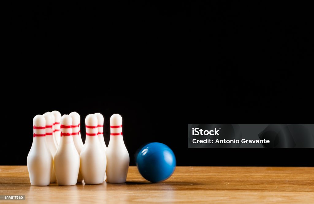 Bowling pins and bowling ball in miniature Bowling pins and bowling ball in miniature. American Football - Sport Stock Photo