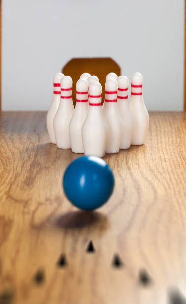 istock Bowling pins and bowling ball in miniature 644820452