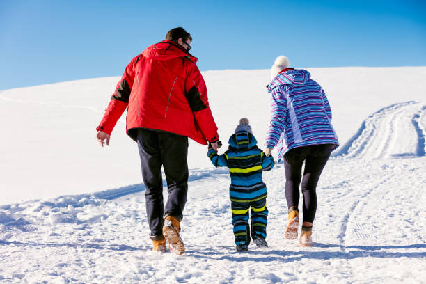 istock Attractive family having fun in a winter park on mountain 644820920