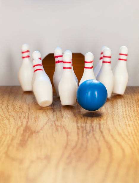 istock Bowling pins and bowling ball in miniature 644824144