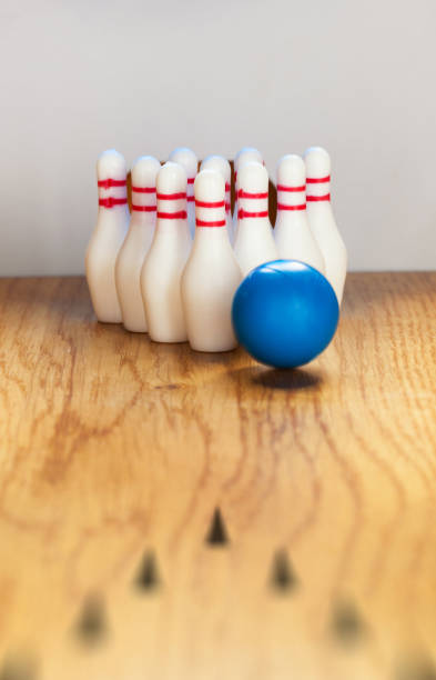 istock Bowling pins and bowling ball in miniature 644828962