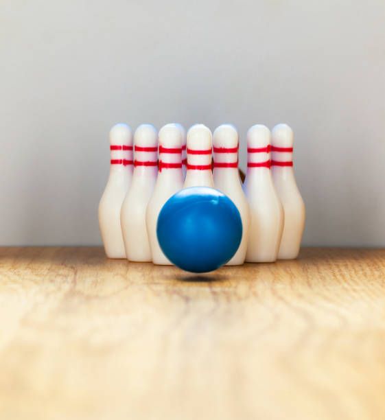 istock Bowling pins and bowling ball in miniature 644830516