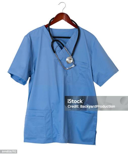 Blue Scrubs Shirt For Medical Professional Hanging On Door Stock Photo - Download Image Now