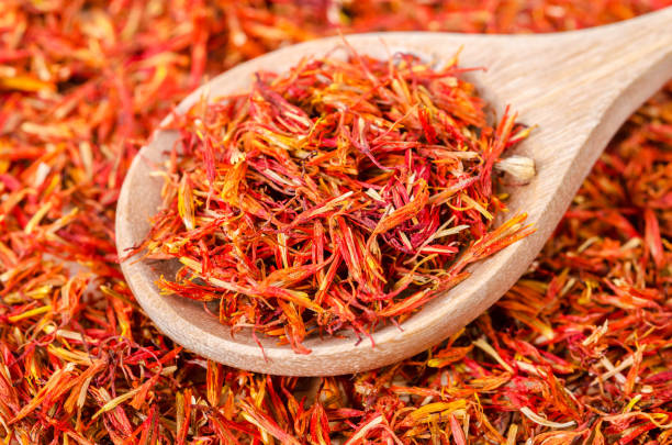 istock Dry safflower in wooden spoon 644916588
