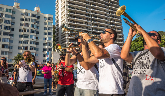 27 November, 2016. Music band playing trombones and saxophone in the street at Festival Fanfare Activist Festival de Fanfarras Ativistas - HONK RiO 2016 near Leme district, Rio de Janeiro, Brazil