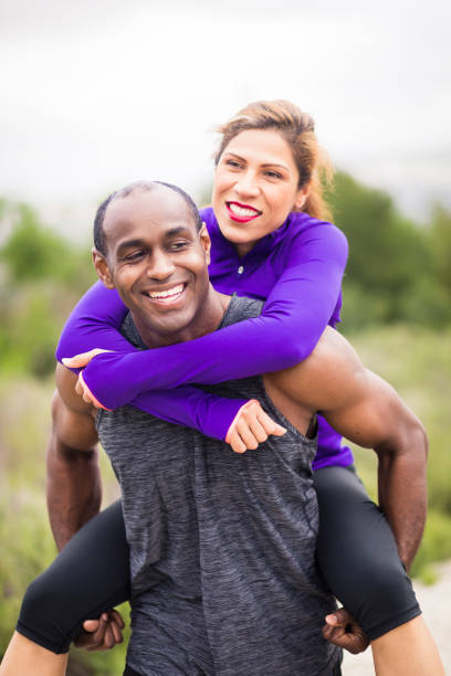 istock Attractive Diverse Couple Working Out 644922538