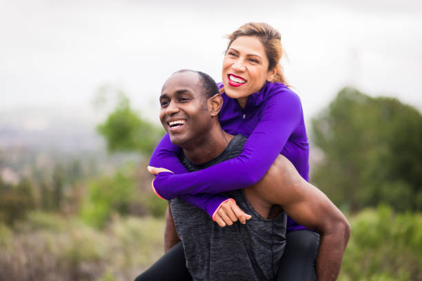 istock Attractive Diverse Couple Working Out 644922588