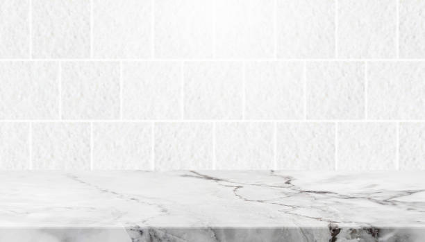istock Stone table top and background of grey granite stone tile wall 644923392