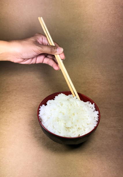 istock Asian hand holding chopsticks Ready to eat 644923408
